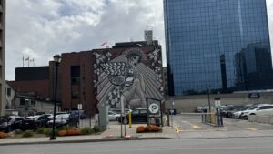 Mural art covering an entire side of a building in downtown London, Ontario.